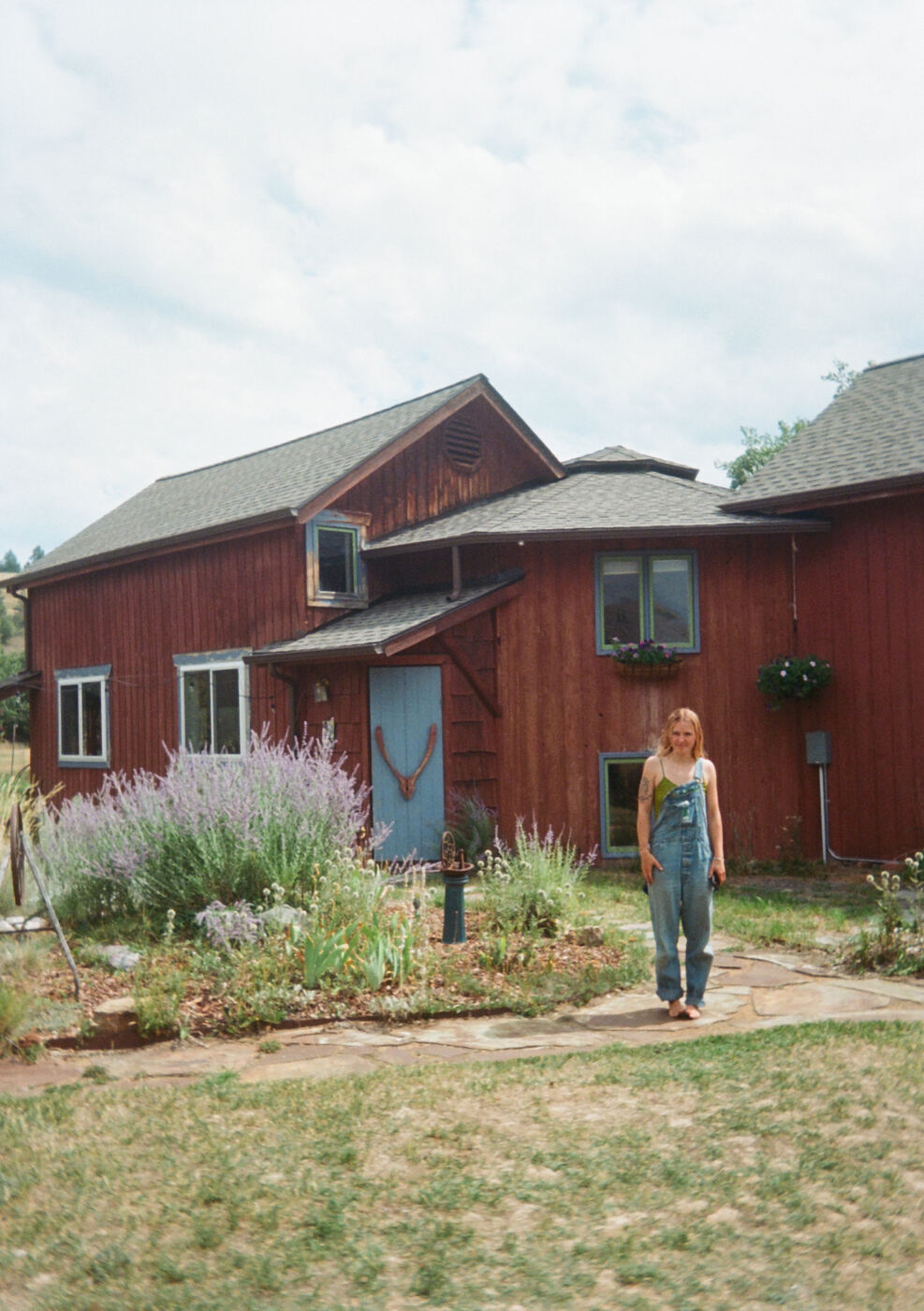 Maria in front of her childhood home
