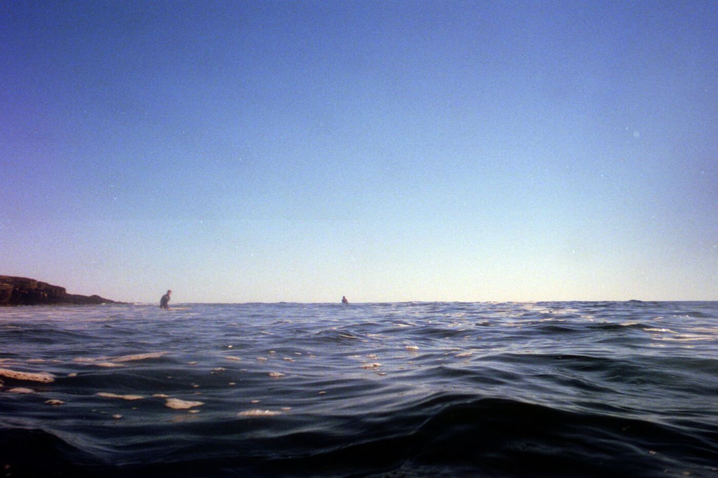 This is taken on a waterproof disposable camera. Surfing in the winter in Cape Elizabeth. Pictured are Satchel and Owen, I believe.
